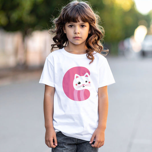 Girl wearing a white cotton t shirt with the letter C in the shape of a cat illustration, hands in pocket